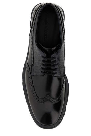 ALEXANDER MCQUEEN Black Leather Lace-Up Shoes for Men with English Perforations, Round Toe, and Rubber Sole