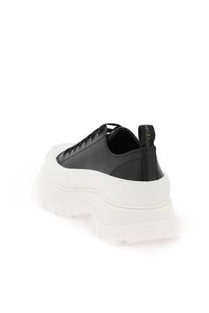 ALEXANDER MCQUEEN LEATHER TREAD SLICK Men's Sneakers with Contrasting Graffiti Logo Print