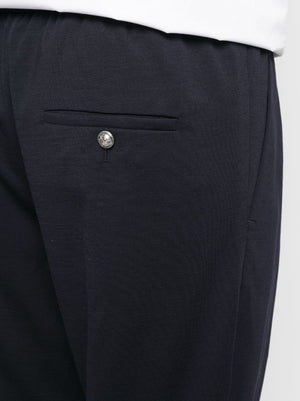 BALMAIN Embossed-Button Drawstring-Waist Trousers in Bleu Fonc for Men | SS23 Collection