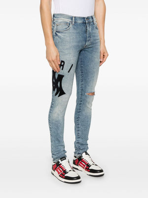 AMIRI Suede Applique Logo Skinny Jeans